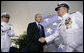 President George W. Bush congratulates Admiral Tom Collins for his 38 years of service in the U.S. Coast Guard, including the last four as Commandant, during the U.S. Coast Guard's Change of Command Ceremony Thursday, May 25, 2006, at Fort Lesley J. McNair in Washington, D.C. Looking on is Admiral Collins' successor, Admiral Thad Allen. White House photo by Eric Draper