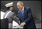 President George W. Bush presents a diploma to class valedictorian Jessamyn Jade Liu during 2006 graduation ceremonies Saturday, May 27, 2006, at the U.S. Military Academy in West Point, N.Y. White House photo by Shealah Craighead