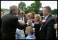 President George W. Bush speaks with law enforcement family members at the Annual Peace Officers' Memorial Service at the U. S. Capitol Monday, May 15, 2006. The service honors fallen federal, state and local law enforcement officers. White House photo by Kimberlee Hewitt