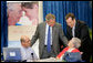 President George W. Bush and Health and Human Services Secretary Mike Leavitt with seniors at a Medicare Prescription Drug Benefit Enrollment Event at Broward Community College in Coconut Creek, Fla., Tuesday, May 9, 2006. White House photo by Eric Draper