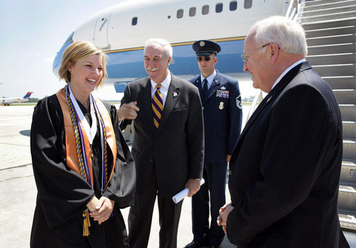 Upon landing in Louisana, Vice President Dick Cheney talks with Louisiana State University Student Body President Michelle Gieg and Chancellor Sean O'Keefe alongside Air Force Two. The vice president delivered the commencement address to over 3,000 bachelors, masters, and doctoral students. White House photo by David Bohrer