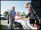 President George W. Bush meets with residents during a surprise stop in a Pottstown, Pa., neighborhood Wednesday, May 24, 2006 , after his visit to the nearby Limerick Generating Station in Limerick, Pa. White House photo by Kimberlee Hewitt