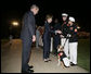 President George W. Bush and Laura Bush greet Marines following an Evening Parade, May 5, 2006, at the Marine Barracks in Washington, D.C. White House photo by Paul Morse