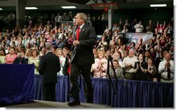 President George W. Bush walks on stage to deliver remarks on the No Child Left Behind Act at Butterfield Junior High School in Van Buren, Ark., Tuesday, May 11, 2004. "Under the new law, when children are falling behind, the schools that need the most attention get extra help, extra money, so the children can catch up," said the President in his remarks.  White House photo by Paul Morse