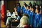 Laura Bush listens to the choir of the P.S. 92 Harry T. Stewart School in Corona, N.Y., during a grant presentation by the Laura Bush Foundation for America's Libraries Monday, May 10, 2004. White House photo by Tina Hager