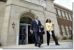 President George W. Bush and Cheryl Brown Henderson, President and CEO of Brown Foundation for Educational Equity, Excellence and Research, walk to the stage during the 50th anniversary of Brown V. Board of Education at the National Historic Site named in its honor in Topeka, Kan., Monday, May 17, 2004.  White House photo by Eric Draper