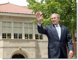 President George W. Bush waves to the audience before delivering remarks during the 50th anniversary of Brown V. Board of Education at the national historic site named in its honor in Topeka, Kan., Monday, May 17, 2004.  White House photo by Eric Draper