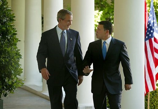 President George W. Bush and His Majesty King Abdullah Bin Al Hussein of Jordan walk together after holding a joint press conference in the Rose Garden Thursday, May 6, 2004. White House photo by Paul Morse
