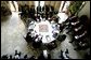 President George W. Bush, seated at right, discusses the Middle East peace process with Prime Minister Ariel Sharon of Israel, to the President's left, and Palestinian Prime Minister Mahmoud Abbas, to the President's right, during their trilateral meeting in Aqaba, Jordan, Wednesday, June 4, 2003. White House photo by Eric Draper