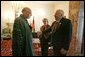 Vice President Dick Cheney shakes hands with newly-elected President Hamid Karzai of Afghanistan before departing Kabul, Afghanistan, Dec. 7, 2004. Vice President Dick Cheney and Lynne Cheney flew to Afghanistan to attend the historic swearing-in ceremony of President Karzai. White House photo by David Bohrer