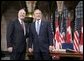 Before a bilateral session at Parliament Hill, President George W. Bush and Canadian Prime Minister Paul Martin meet in the rotunda in Ottawa, Canada, Nov. 30, 2004. White House photo by Paul Morse