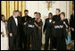 President George W. Bush and Mrs. Laura Bush hold jackets they were given by Special Olympics athletes after they listened to the band Rascal Flatts in the East Room of the White House following a dinner honoring the Special Olympics and founder Eunice Kennedy Shriver, Monday, July 10, 2006. White House photo by Paul Morse