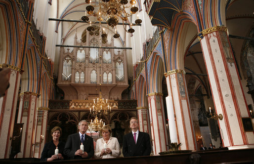 President George W. Bush and Laura Bush stand with German Chancellor Angela Merkel and Pastor Peter Neumann in St. Nikolai Church in Stralsund, Germany, Thursday, July 13, 2006. White House photo by Paul Morse