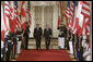 President George W. Bush and Prime Minister Stephen Harper of Canada hold a joint press conference in the East Room Thursday, July 6, 2006. "I'm impressed by his leadership style," said President Bush. "I appreciate the fact that he doesn't mince words, he tells me what's on his mind and he does so in a real clear fashion." White House photo by Kimberlee Hewitt