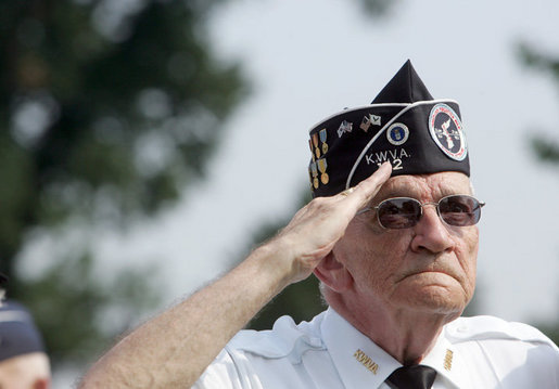 A Korean War veteran salutes during the singing of the National Anthem, Thursday, July 27, 2006 during the 2006 Korean War Veterans Armistice Day Ceremony held at the Korean War Memorial in Washington, D.C. Vice President Dick Cheney honored the veterans in an address and remembered fallen soldiers in a wreath laying ceremony at the memorial. White House photo by David Bohrer