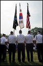 An honor guard composed of Korean War veterans holds flags prior to the start of the 2006 Korean War Veterans Armistice Day Ceremony held at the Korean War Memorial on the National Mall in Washington, D.C., Thursday, July 27, 2006. White House photo by David Bohrer