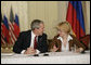 President George W. Bush talks with Irina Yasina , a representative of Open Russia, at a roundtable discussion with Civil Society at the Consul General’s residence, Friday, July 14, 2006 in St. Petersburg, Russia. White House photo by Eric Draper