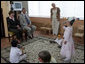 During a tour of the Pediatric HIV/AIDS Clinic Center of Russia, Mrs. Laura Bush and Dr. Evgeny Voronin listen to Gayla, a patient, perform in the Music Room Friday, July 14, 2006, in St. Petersburg, Russia. Music instructor Valentina Leontieva looks on. White House photo by Shealah Craighead