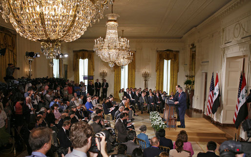 President George W. Bush and Iraqi Prime Minister Nouri al-Maliki hold a joint press conference in the East Room Tuesday, July 25, 2006. "We are determined to defeat terrorism, and the security plan for Baghdad has entered the second phase and it's achieving its objectives in hunting the terrorist networks and eliminating it," said the Prime Minister in his remarks. White House photo by Paul Morse