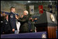 Vice President Dick Cheney pins the Purple Heart Medal onto Master Sergeant Henry G. Christle, Jr., Monday, July 10, 2006, during a rally for the Michigan National Guard and Joint Services at Selfridge Air National Guard Base in Harrison Township, Mich. Master Sergeant Christle was wounded in action on March 23, 2004 while serving as a Special Operations Weather Team Forecaster and Observer assigned to the Combined Joint Special Operations Task Force 180, Afghanistan. White House photo by David Bohrer