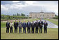 The G8 leaders pose of a photograph at Konstantinvosky Palace in Strelna, Russia, Sunday, July 16, 2006. From left, they are: Italian Prime Minister Romano Prodi; German Chancellor Angela Merkel; United Kingdom Prime Minister Tony Blair; French President Jacques Chirac; Russian President Vladimir Putin; President George W. Bush; Japanese Prime Minister Junichiro Koizumi; Canadian Prime Minister Stephen Harper; President of the European Union Prime Minister Matti Vanhanen of Finland, and European Commission President Jose Manuel Barroso. White House photo by Paul Morse