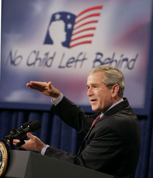 President George W. Bush gestures as he addresses his remarks Thursday, Oct. 5, 2006, at the Woodridge Elementary and Middle Campus in Washington, D.C., where President Bush praised the education advancements made through the No Child Left Behind law but also talked about ideas to strengthen the law in the future. White House photo by Paul Morse