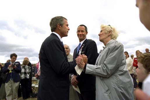 President George W. Bush talks to relatives of the victims from Flight 93 after laying a wreath at the crash site in Somerset County Pennsylvania on September 11, 2002. White House photo by Eric Draper.