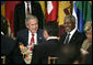 President George W. Bush is seated next to Secretary-General Kofi Annan during a luncheon of world leaders Tuesday, Sept. 19, 2006, at the United Nations, where the President later addressed the 61st General Assembly. White House photo by Eric Draper