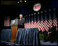 Vice President Dick Cheney delivers remarks on the economy and the global war on terror, Tuesday, September 19, 2006, at the National Automobile Dealers Association 2006 Legislative Conference in Washington, D.C. Seated on stage is Phil Brady, President of the National Automobile Dealers Association. White House photo by Kimberlee Hewitt