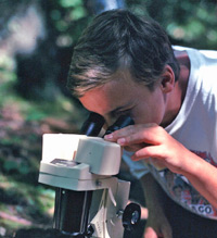 This handsome young man is using a microscope in the Pictured Rocks National Lakeshore science education program.