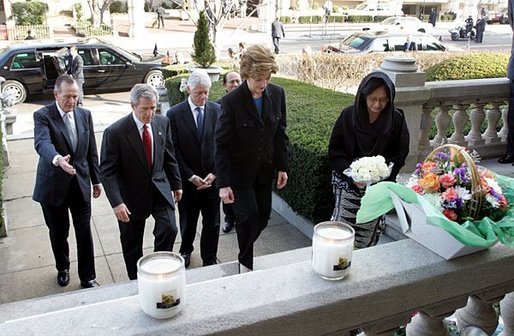 Laura Bush approaches a candle-lit memorial honoring the victims of the recent tsunami at the Embassy of Indonesia during a visit with President George W. Bush and former Presidents Bush and Clinton in Washington, D.C., Monday, Jan. 3, 2005. White House photo by Susan Sterner.