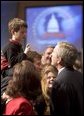 President George W. Bush talks with a young boy prior to delivering remarks on his legislative priorities and initiatives for the 109th Congressional session of Congress during a retreat in White Sulphur Springs, W.V., Friday, Jan. 28, 2005. White House photo by Paul Morse