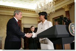 President Bush shakes hands with Dr. Condoleezza Rice after introducing her those in attendence for her ceremonial swearing-in at the U.S. Department of State Friday, Jan. 28, 2005.  White House photo by Eric Draper