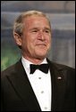 President George W. Bush listens as Vice President Dick Cheney introduces him during a Black Tie and Boots Ball in Washington, D.C., Jan 19, 2005. Chief Justice William Rehnquist will swear President Bush into office to serve his second term during the 55th Presidential Inauguration held Jan. 20, 2005. White House photo by Eric Draper