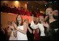 Audience members display the Texas Longhorn symbol in support of President Bush during the Texas State Society's Black Tie and Boots Inaugural Ball in Washington, D.C., Wednesday, Jan. 19, 2005. White House photo by Paul Morse