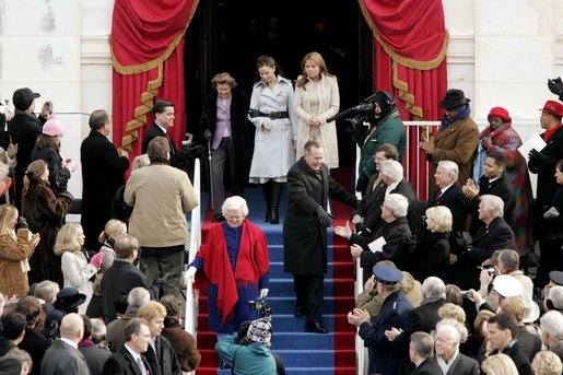 Former President George H. W. Bush and former First Lady Barbara Bush lead Jenna Welch, Barbara Bush and Jenna Bush to their seats to watch the swearing-in ceremony of President George W. Bush at the U.S. Capitol, Jan. 20, 2005. White House photo by Paul Morse