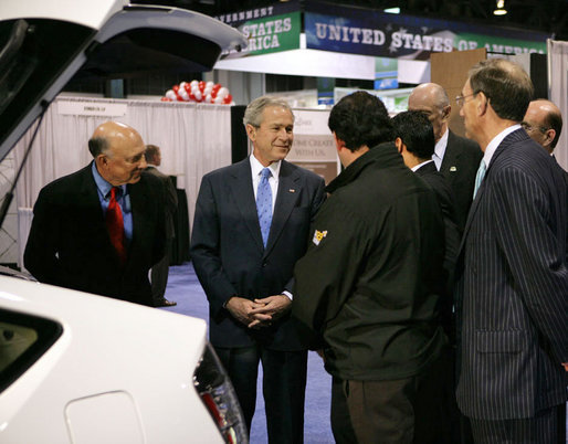 President George W. Bush stops to talk to the manufacturers of a converted plug-in hybrid electric vehicle during his tour of the Washington International Renewable Energy Conference 2008 Wednesday, March 5, 2008, at the Washington Convention Center in Washington, D.C. White House photo by Chris Greenberg