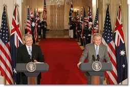 President George W. Bush and Australian Prime Minister Kevin Rudd react to a question during their joint press availability in the East Room of the White House Friday, March 28, 2008. White House photo by Joyce N. Boghosian