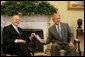 President George W. Bush welcomes Dr. Larry Faulkner, Chairman of the National Mathematics Advisory Panel, to the Oval Office Thursday, March 13, 2008. Dr. Faulkner presented the President with the final report containing the findings and recommendations of the National Mathematics Advisory Panel. White House photo by Joyce N. Boghosian