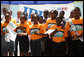 A choir sings a welcome song for Mrs. Laura Bush during her visit to the IDEJEN educational program at the College de St. Martin Tours Thursday, March 13, 2008, in Port-au-Prince, Haiti. White House photo by Shealah Craighead