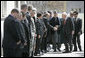 Vice President Dick Cheney is escorted by President of Afghanistan Hamid Karzai as he greets Afghan officials upon arrival to Gul Khana Palace in Kabul Thursday, March 20, 2008. The Vice President met with President Karzai and Afghan officials to reaffirm America's commitment to Afghanistan and discuss ways the U.S. would continue to help Afghanistan become a more prosperous and stable nation. White House photo by David Bohrer