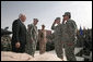 Staff Sgt. Shane Lindsey, second right, and PFC Veronica Alfaro, far right, salute Vice President Dick Cheney after being awarded the Bronze Star Tuesday, March 18, 2008, during a rally for U.S. troops at Balad Air Base, Iraq. White House photo by David Bohrer