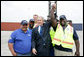 President George W. Bush joins port workers for a photo following his remarks on U.S. trade policy Tuesday, March 18, 2008, at the Blount Island Marine Terminal in Jacksonville, Fla. White House photo by Chris Greenberg