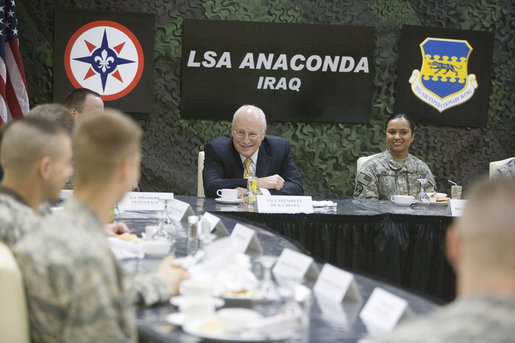 Vice President Dick Cheney talks with U.S. troops during breakfast Tuesday, March 18, 2008, at Balad Air Base, Iraq. Following a day of meetings in Baghdad the Vice President and Mrs. Cheney were overnight guests at the base. White House photo by David Bohrer