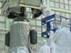 Engineers integrate the spacecraft and propulsion units of SDO.