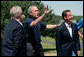 President George W. Bush waves to the press as he welcomes President Nicolas Sarkozy of France to Walker’s Point Saturday, August 11, 2007, in Kennebunkport, Maine. White House photo by Shealah Craighead