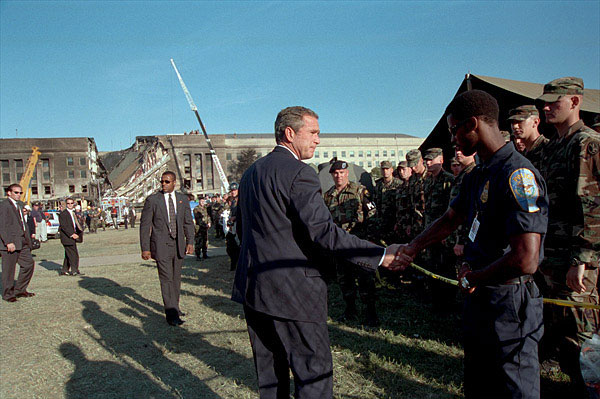 Visting the devistation at the Pentagon, President Bush thank the rescue workers and Pentagon personnel for their diligence through the recent tragedy Sept. 12. White House photo by Eric Draper.