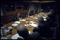 After addressing the nation, President George W. Bush meets with his National Security Council in the Presidential Emergency Operations Center Sept. 11, 2001. White House photo by Eric Draper