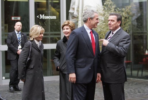President George W. Bush, Laura Bush, German Chancellor Gerhard Schroeder, right, and Mrs. Schroeder-Koepf, left, visit before touring the Gutenberg Museum in Mainz, Germany, Feb. 23, 2005. White House photo by Susan Sterner