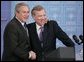 President George W. Bush is welcomed by NATO Secretary General Jaap de Hoop Scheffer during a news conference Tuesday, Feb. 22, 2005, at NATO Headquarters in Brussels. White House photo by Paul Morse